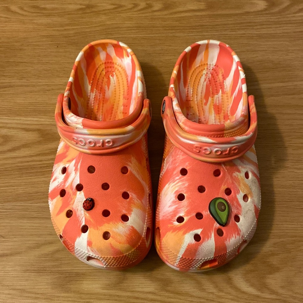 Tie dye orange crocs with JIBBITZ